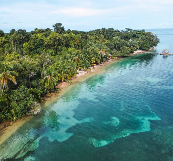 A beautiful view of an island with a jungle